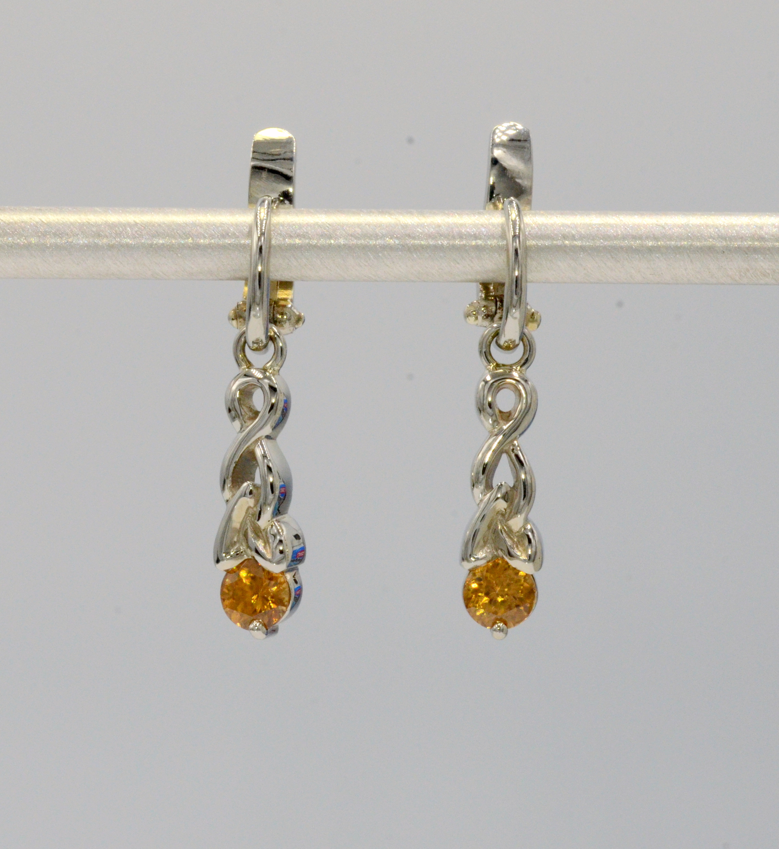 Classic braided design accented with a rich Honey Colored Citrine. 3/4 inch long.  These earrings are worn with our Euro Wire Earrings which are sold separately. Go to About page for further description of Euro Wire Earrings.